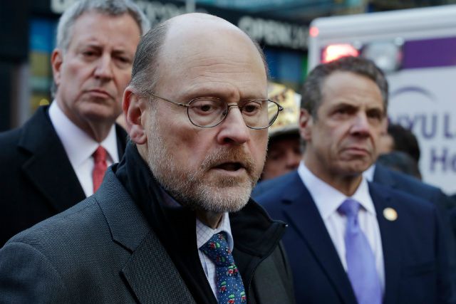 MTA Chairman Joe Lhota, center, talks at a news conference with New York Mayor Bill de Blasio, left, and Governor Andrew Cuomo, outside the Port Authority Bus Terminal in New York.
